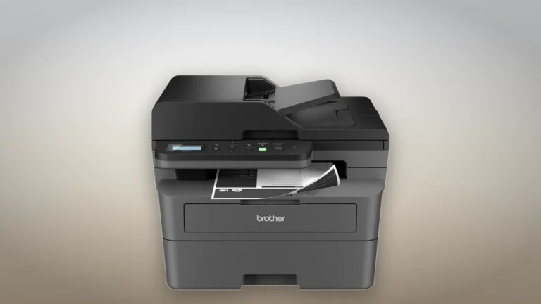 Brother DCP-L2640DW in dark grey seen from the front, with a black and white printed page in the output slot under the control panel