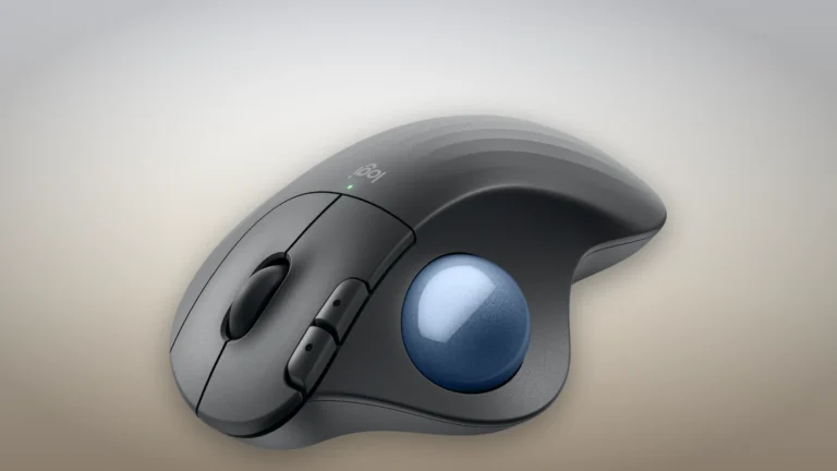Logitech ERGO M575S trackball in Graphite with a blue ball, three-quarter view from the thumb side