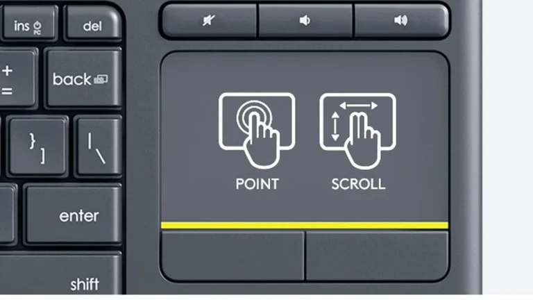 Close view of the Logitech K400 Plus touchpad, the three volume keys above it and the yellow line separating the left and right click zones