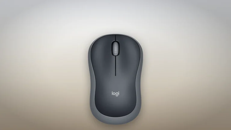 Logitech M185 seen from directly above on a desk surface, showing the symmetrical shell, two main buttons and a central scroll wheel with no side buttons