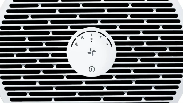 Top of the Blueair Blue Pure 311i Max: the round control disk with auto, night, speed 1 to 3 and Wi-Fi markings, a fan button and a power button, surrounded by the air outlet slots