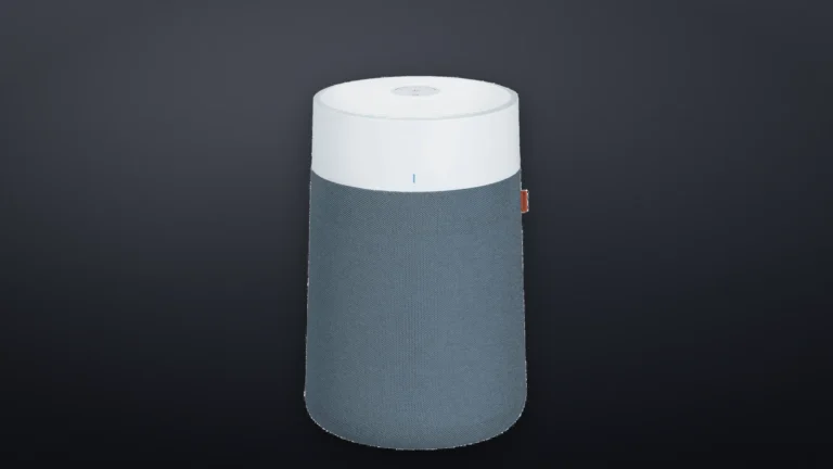 Blueair Blue Pure 311i Max from slightly above, showing the top air outlet, the white housing and the fabric pre-filter with its pull tab