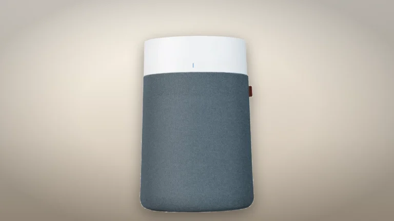 Blueair Blue Pure 311i Max seen straight on, with its white top, blue status light and blue-gray fabric pre-filter