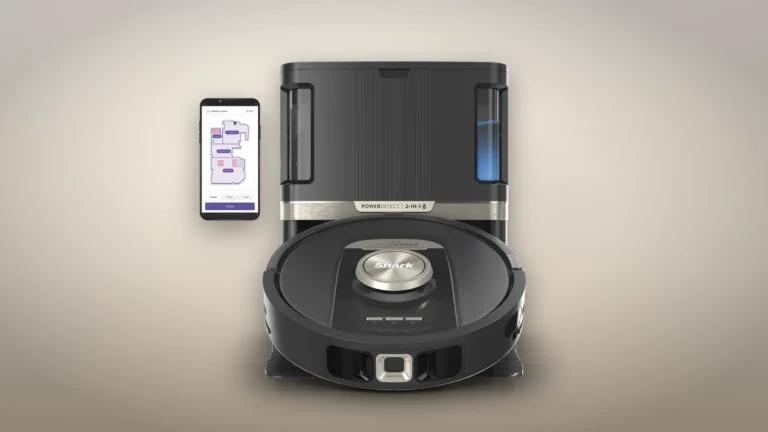 Front view of the Shark RV2820ZE docked on its base, with a phone beside it showing a floor map in the SharkClean app
