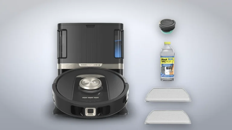 Shark RV2820ZE robot on its NeverTouch Pro base beside the odor cartridge, a bottle of Shark VacMop cleaner and two mop pads